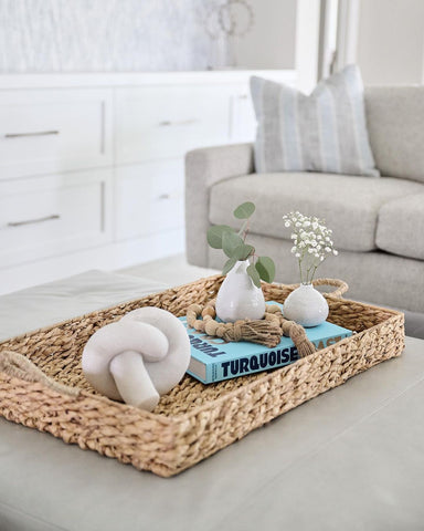 Beach-themed books on coastal coffee table