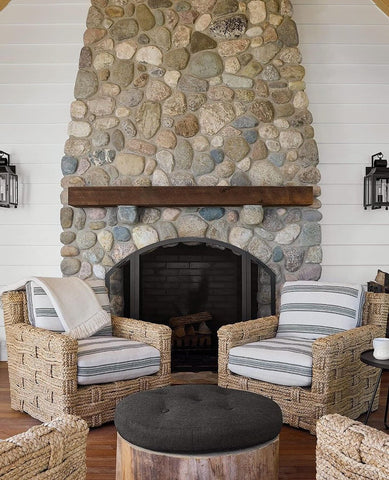 Natural stone fireplace in coastal living room