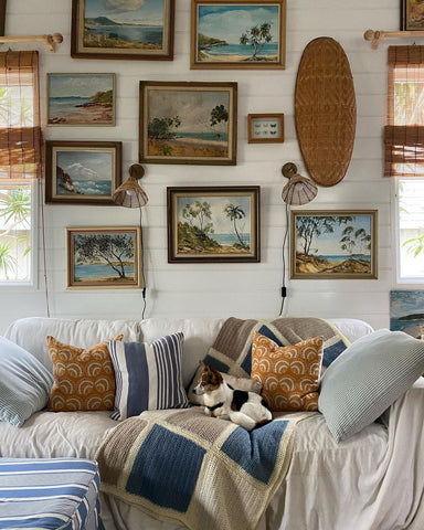 Coastal-themed pillows on sofa