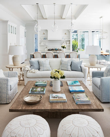 Plush floor cushions in coastal living space