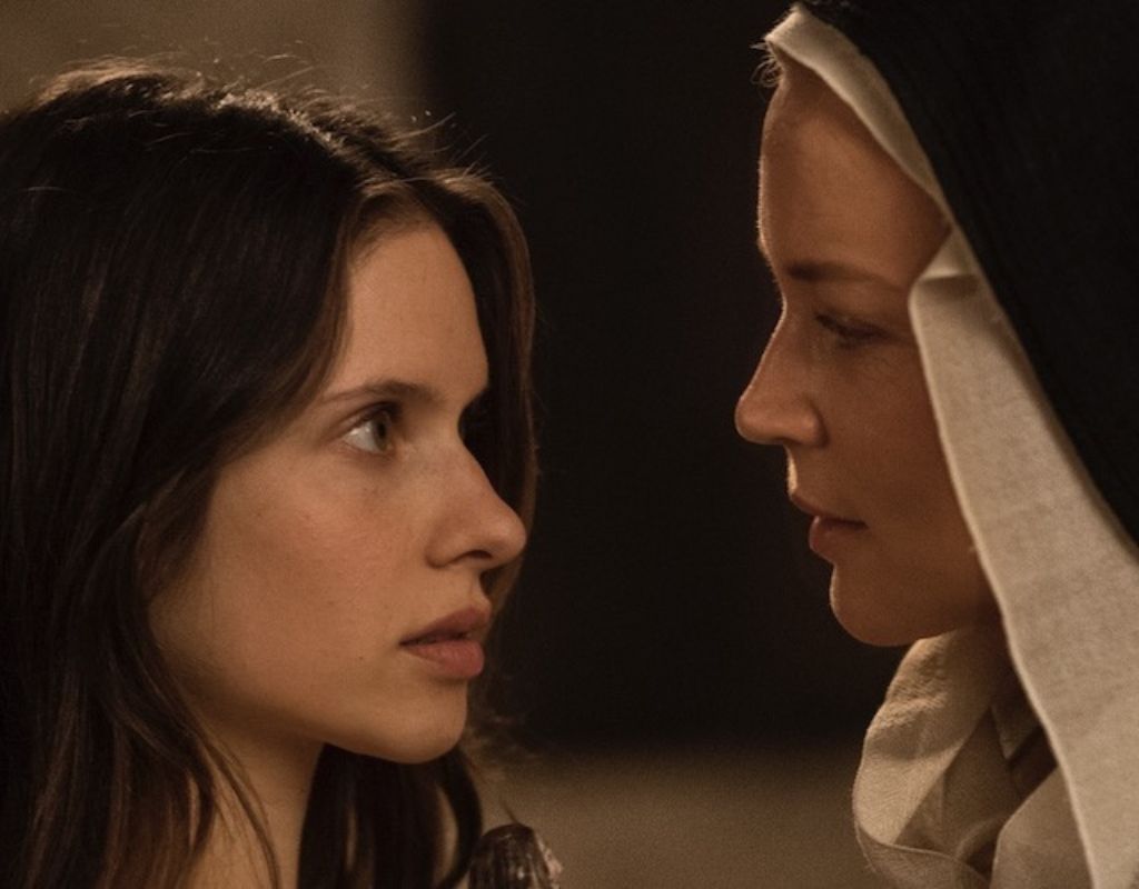 A 17th-century nun becomes entangled in a forbidden lesbian affair, but it's her shocking religious visions that threaten to shake the Church to its very core. In the image one woman is intensely looking at the other, a nun.