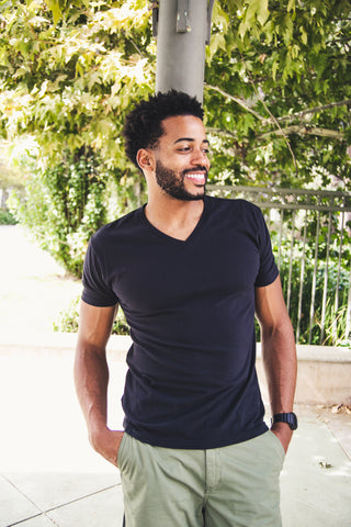 Man wearing a black True Classic v-neck t-shirt