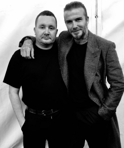 David Beckham wearing a black t-shirt and a wool jacket