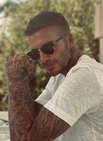 David Beckham wearing a white heather t-shirt 