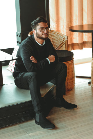 Man wearing Dark Gray suit and white button down shirt