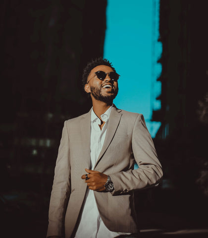 Man wearing Tan suit with White button down shirt