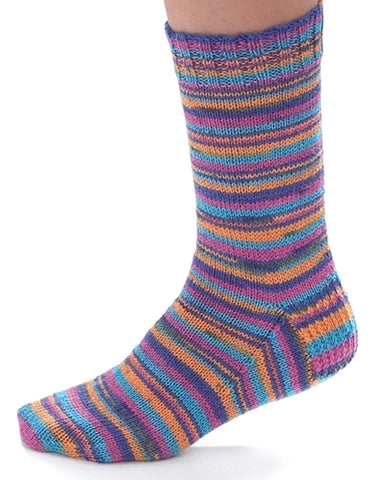 A simple basic knitted sock on a foot with lots of different thin color stripes in purple orang blue green. On a white background
