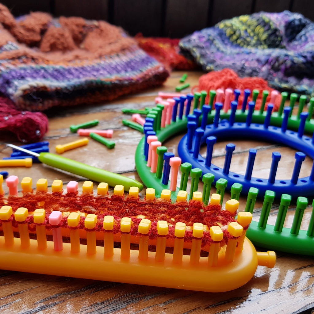 knitting loom with removable and adjustable pegs