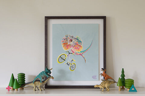 A Lizard artwork by Good Art Australia. Painting framed and sitting on a shelf with kids toys.