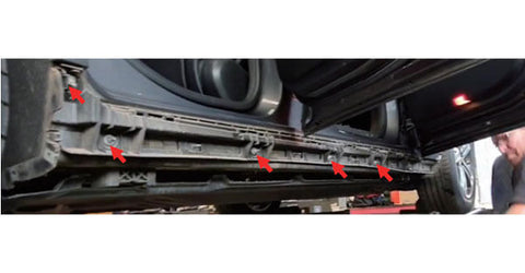 Install the bracket that supports the running boards