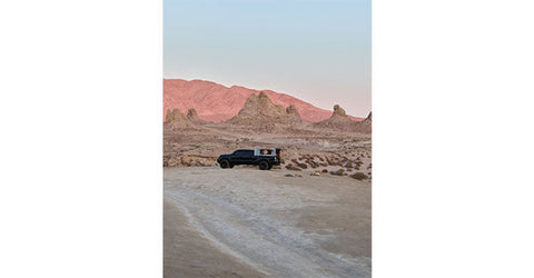 A pickup truck parked in the desert