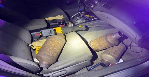 There are many different types of three-way catalytic converters on the seat of an open car.