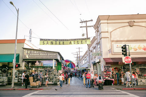 An alley way with vendors and people