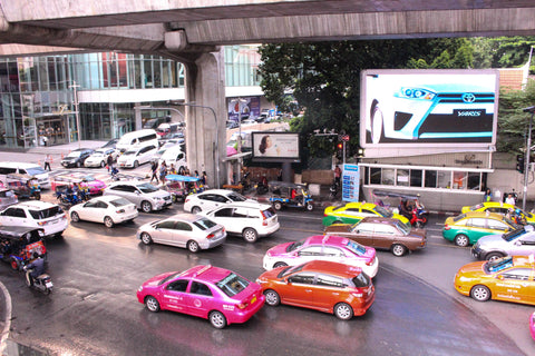 Bangkok traffic and their signature hot pink cabs.