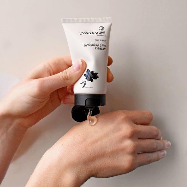 Applying Living Nature Hydrating Glow Exfoliant on hand