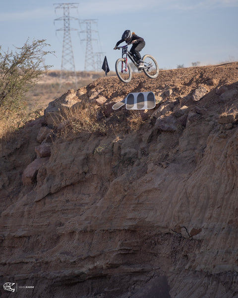 Riding jumping a big AMS drop at Freeride Fiesta