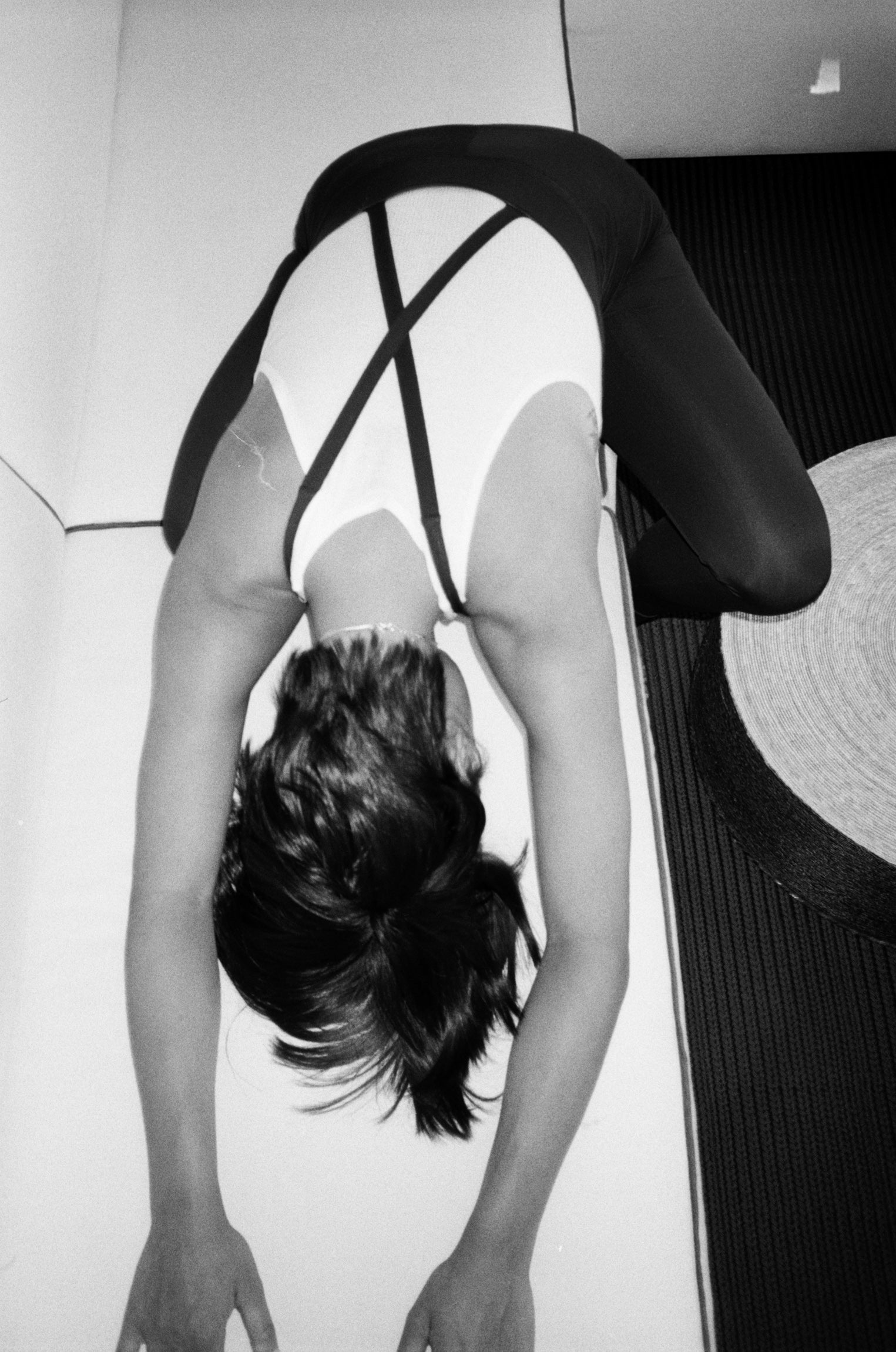 Wear One's At image of model stretching black and white photo