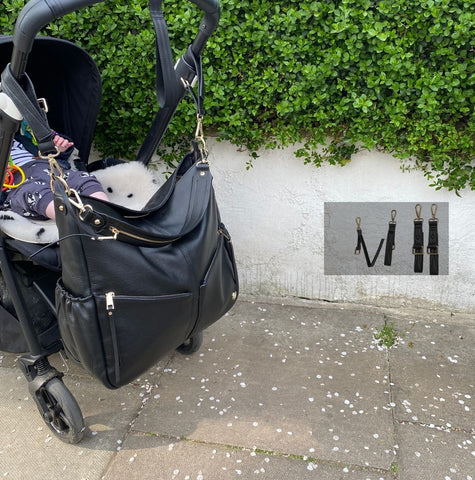 Lennox attached to a pram using KeriKit's universal Buggy Clips