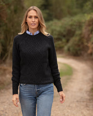 Woman wearing dark knitted jumper