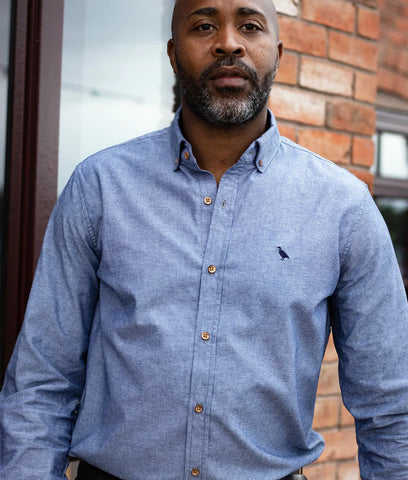 man wearing blue chambray shirt