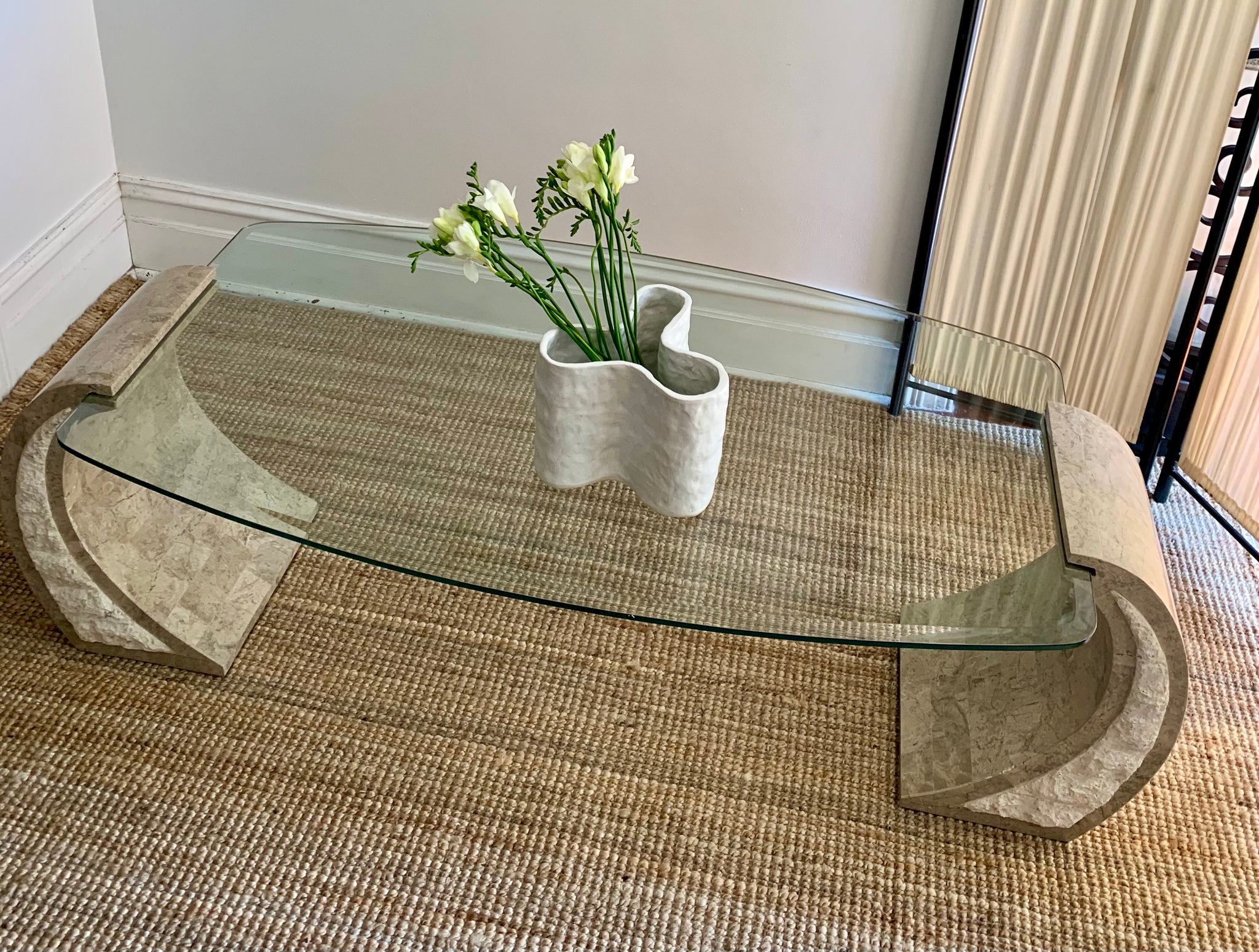 Curved Fossil Stone Coffee Table With Floating Glass Top Curated Spaces