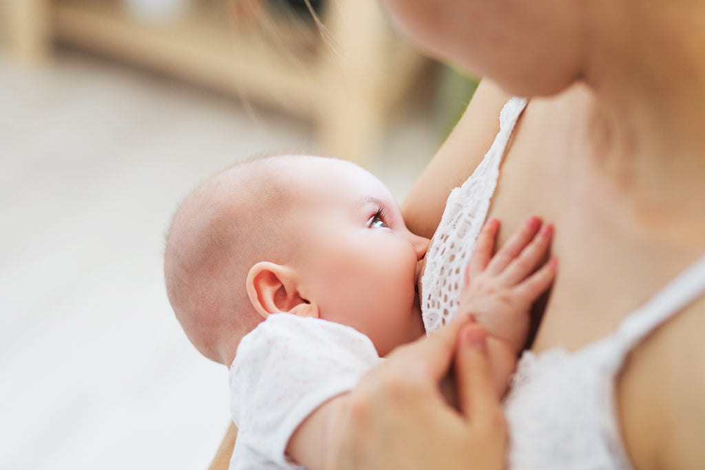 woman breastfeeding baby