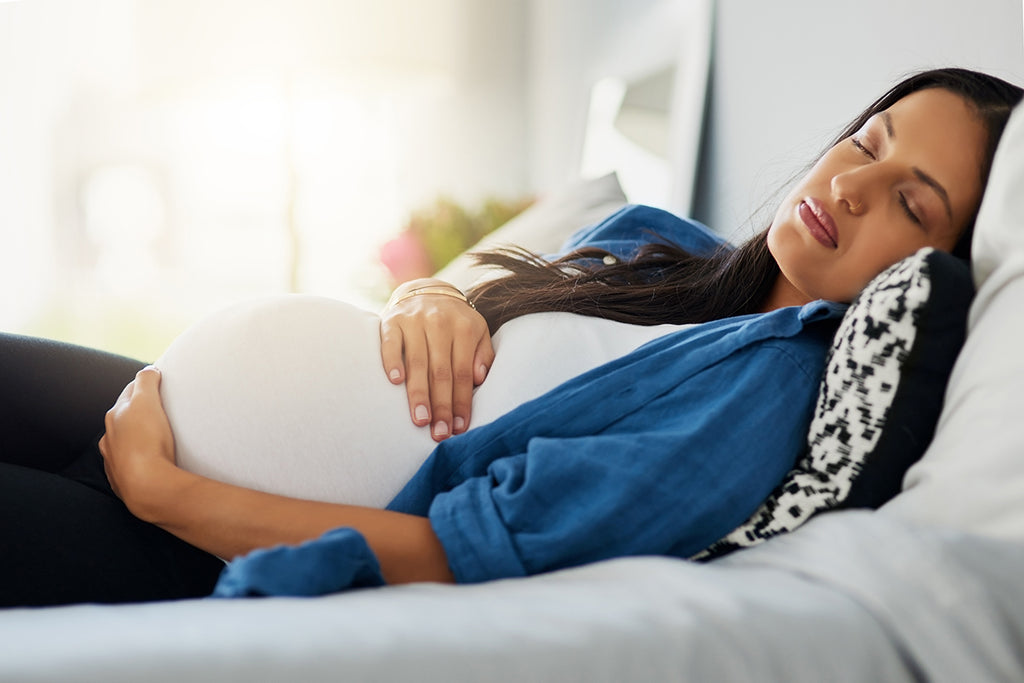 pregnant woman holding her stomach