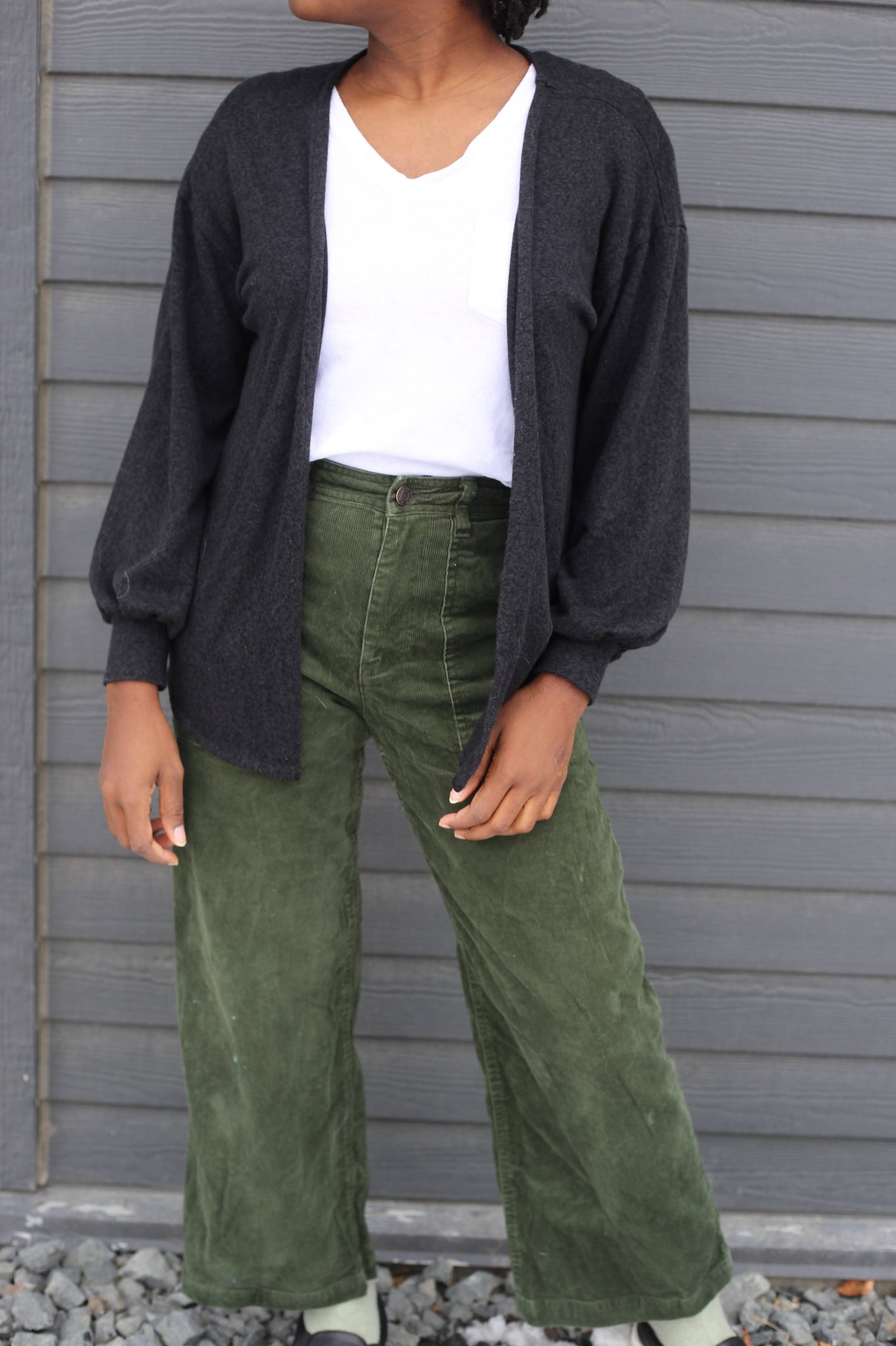 White t-shirt and olive green corduroy pants