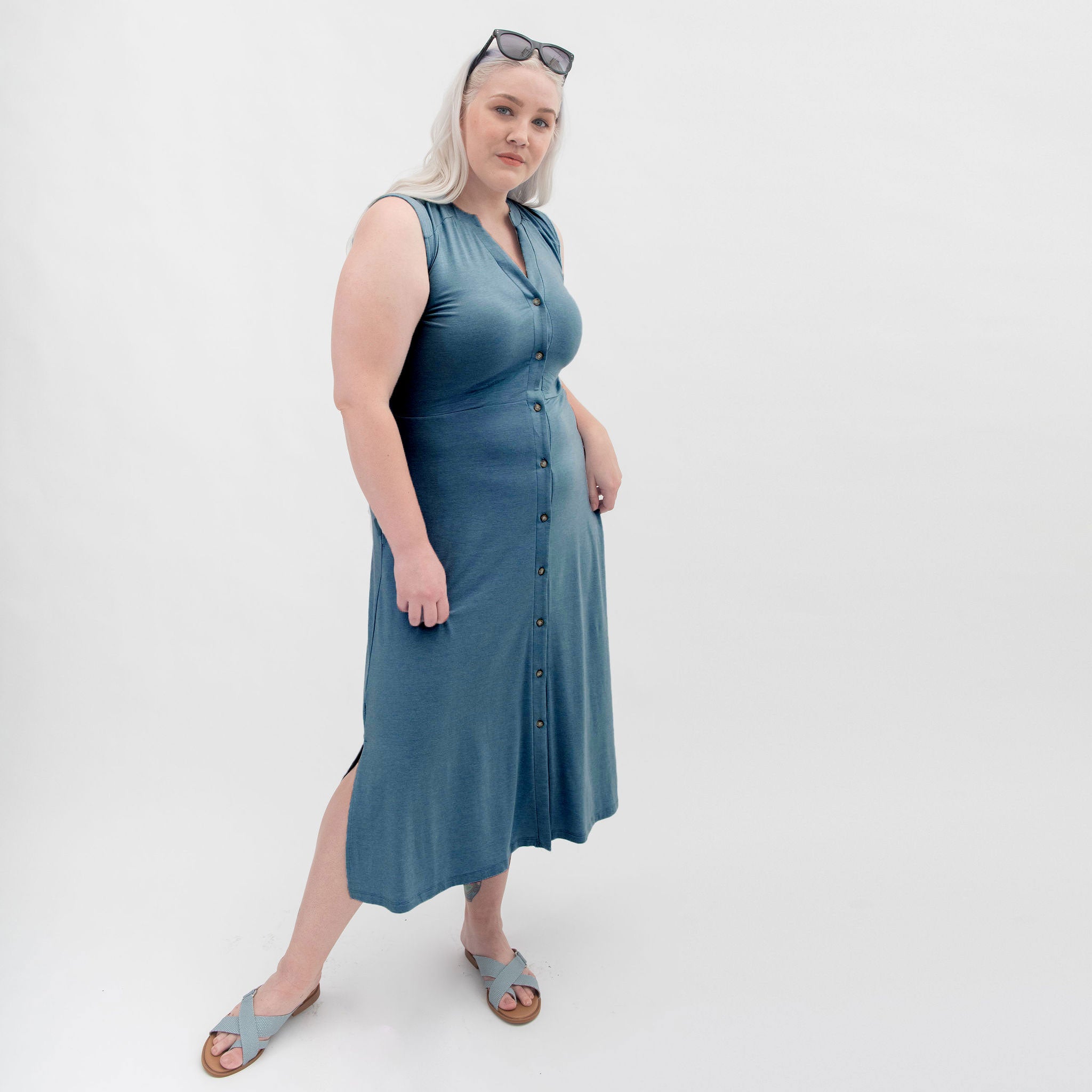 Blue button-front dress with sandals and sun glasses