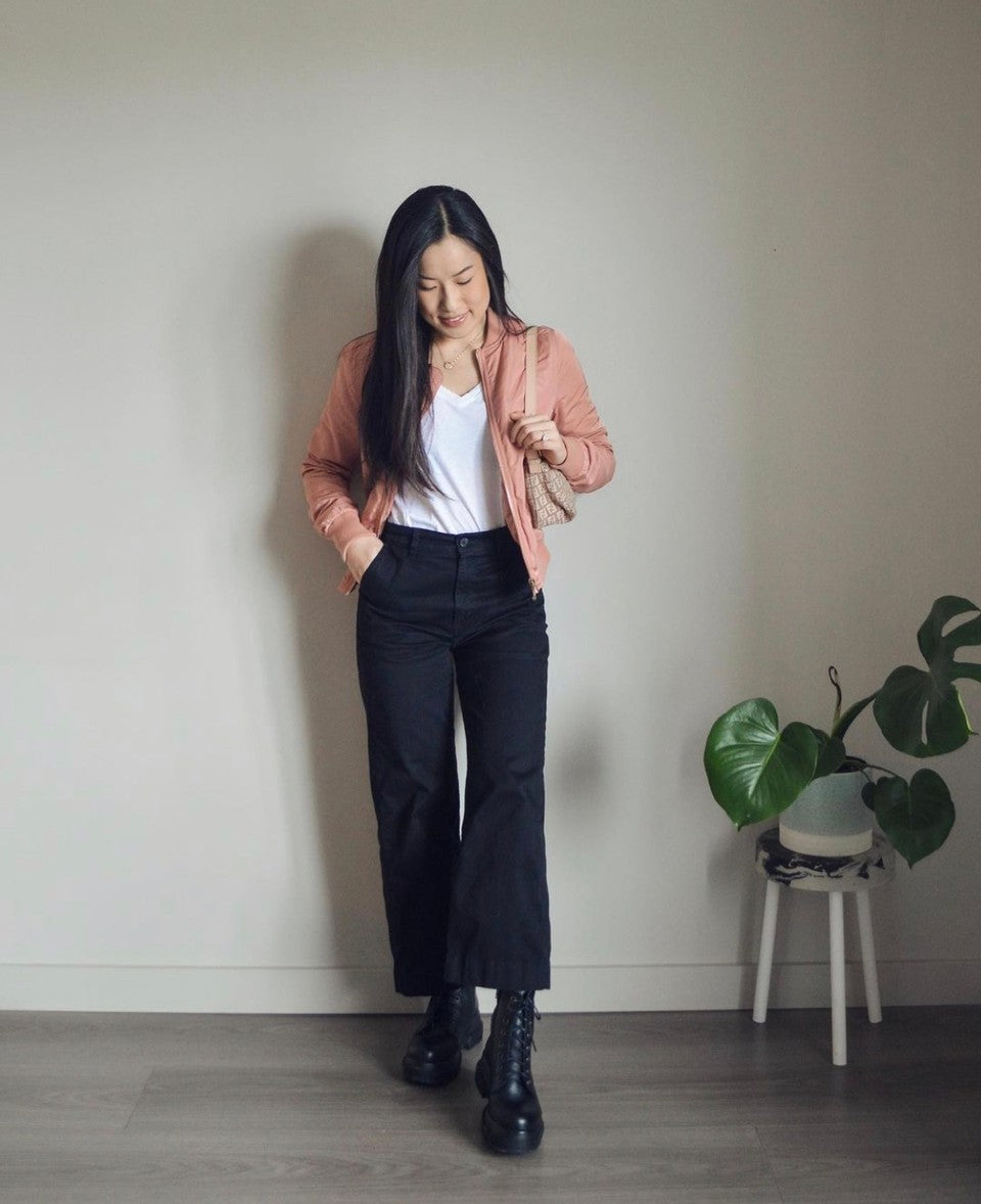 White t-shirt with combat boots and light pink jacket