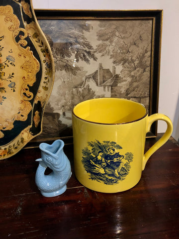 Large yellow antique mug with a mini pale blue Wade gluggle jug milk jug