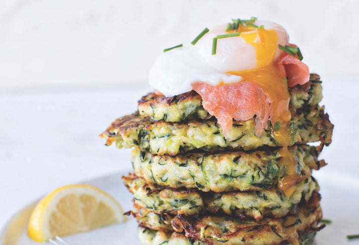 Courgette fritters with smoked trout and poached egg