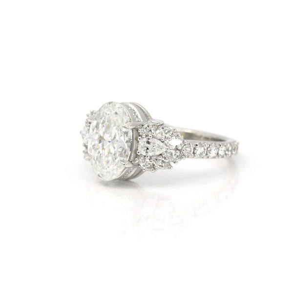 side view of statement engagement ring designer bena jewelry made in montreal with big diamond on white background