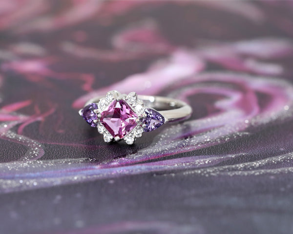platinum diamond pink and purple sapphire custom made bridal ring by bena jewelry designer montreal on dark multi color background