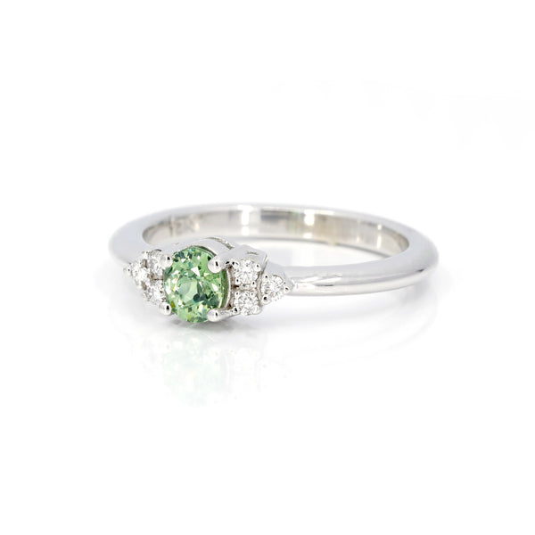 colored gemstone and diamond engagement ring custom made in montreal by bena jewelry on white background