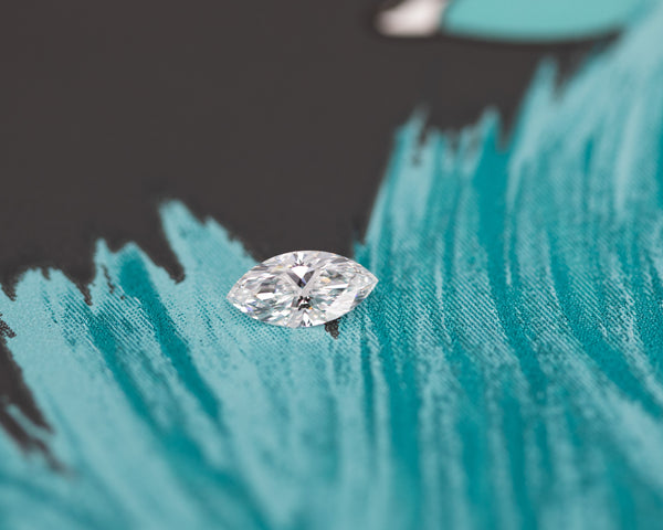 marquise shape lab grown diamond montreal custom made bena jewelry on blue and black background