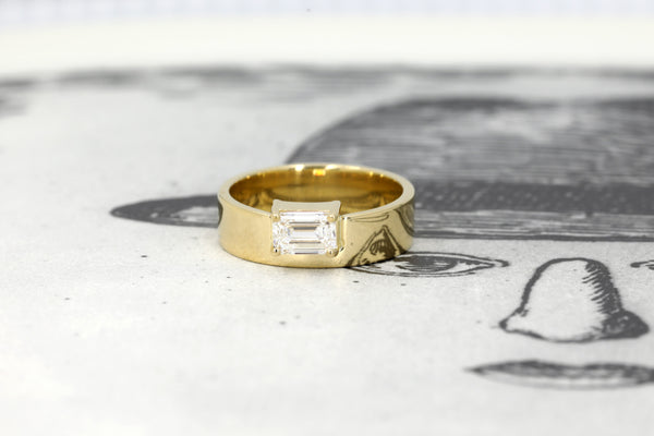 custom made lab grown yellow gold bridal engagement ring made in montreal on black and white background