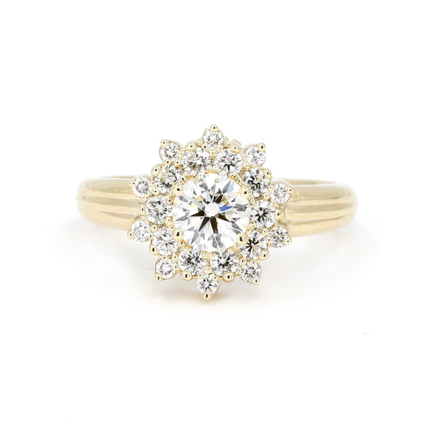 round lab grown diamond and halo yellow gold soleil ring by bena jewelry