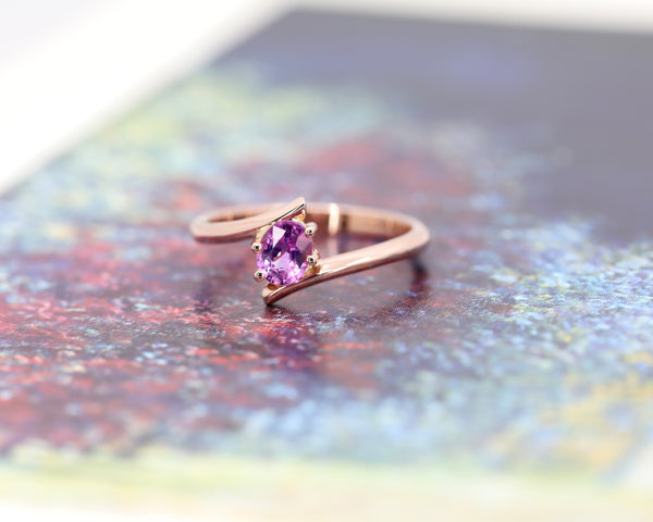 pink sapphire yellow gold custom made engagement ring montreal bena jewelry on multi color background