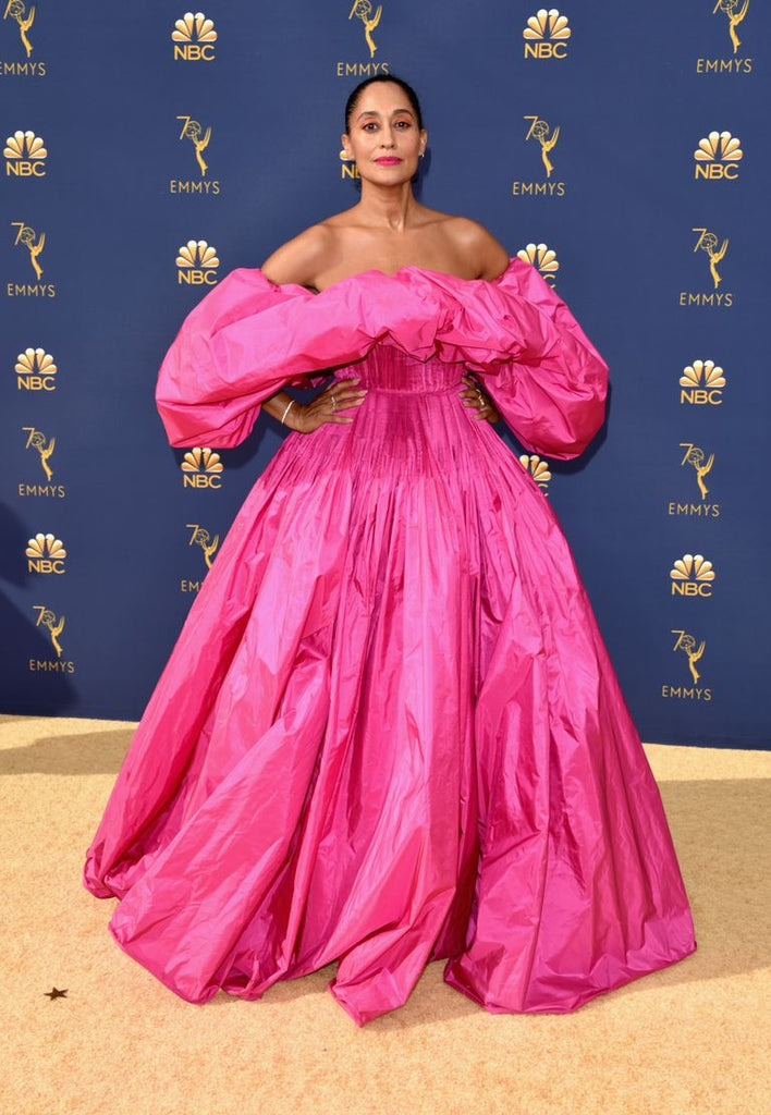 Tracee Ellis Ross in voluminous Valentino hot pink off the shoulder gown at the 2018 Emmy Awards on the red carpet, best dressed