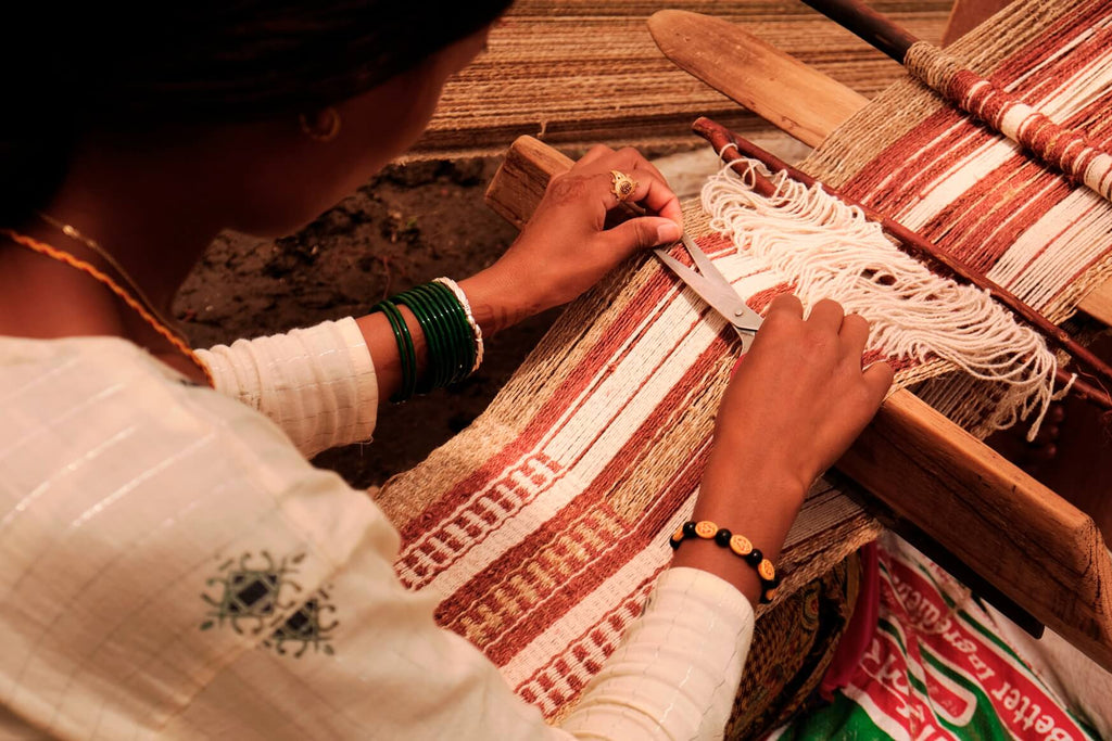 Raw locally Nepali hemp being woven on a backstrap loom