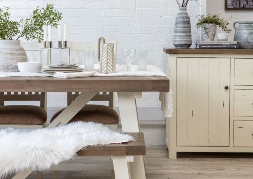 white reclaimed wood dining table with wooden sideboard