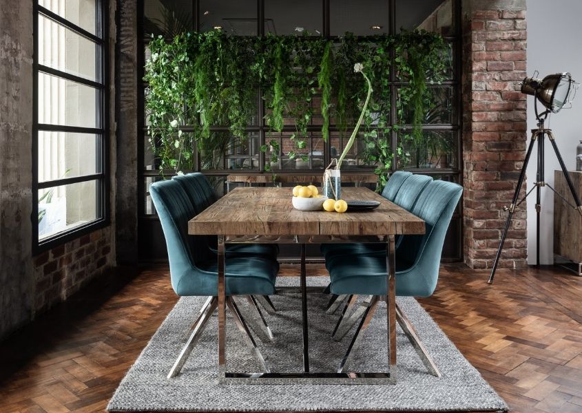 industrial dining table with blue velvet dining chairs