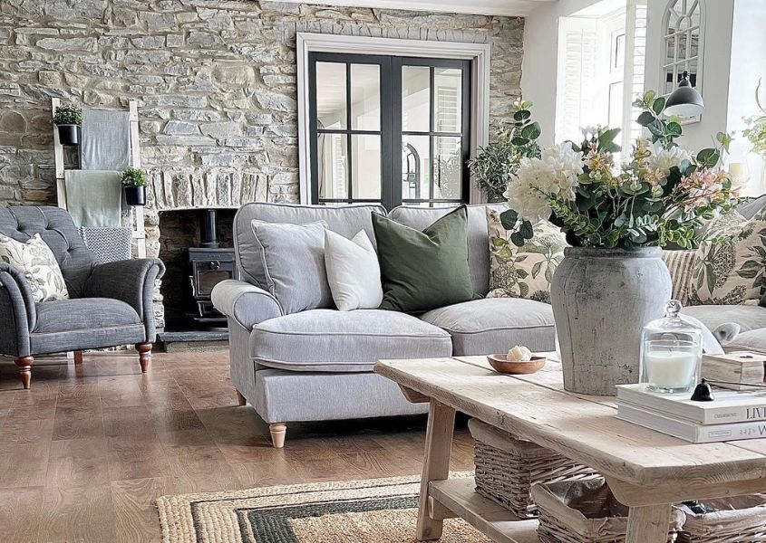 modern farmhouse living room with rustic coffee table with pale blue fabric sofa