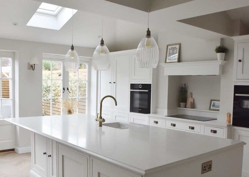 white kitchen with large central breakfast bar