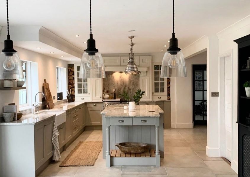 Modern country style grey kitchen with island and glass hanging pendant lights