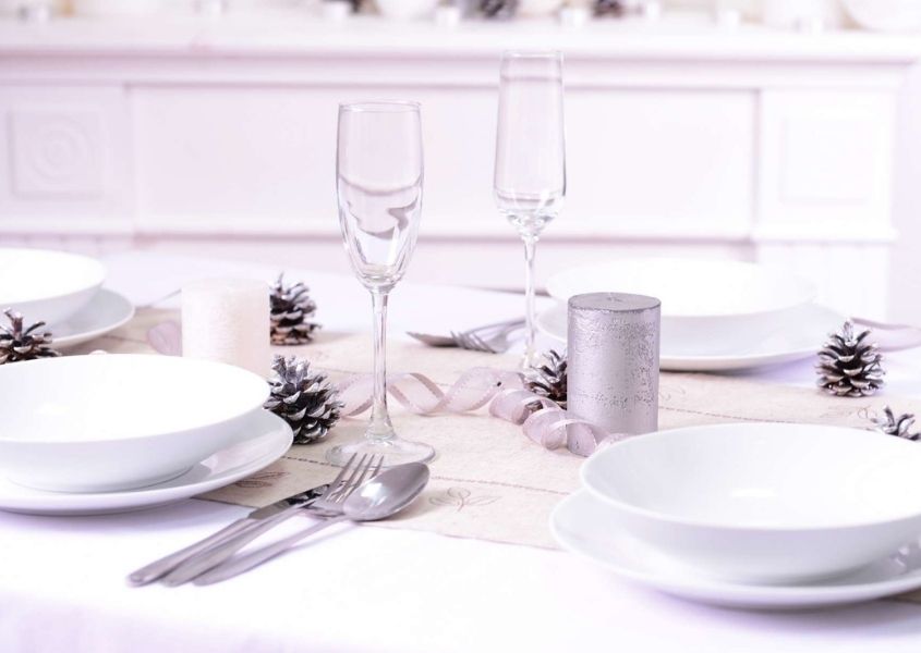 bright white christmas dining table with white plates