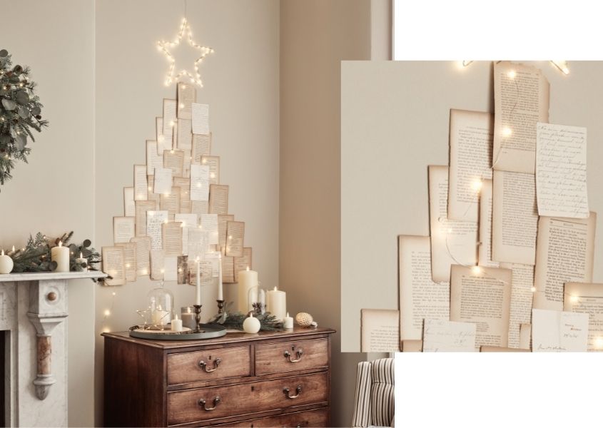 diy paper christmas tree with illuminated star above a wooden sideboard