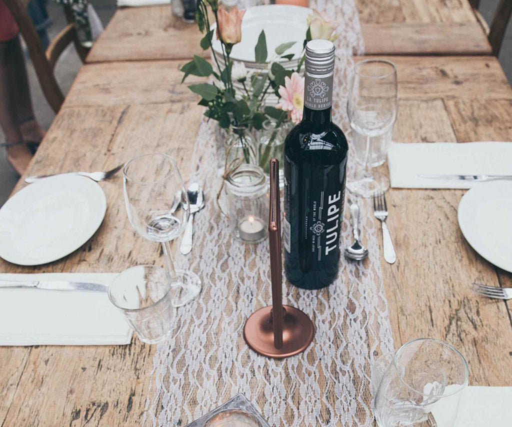 Lace table runner on reclaimed wood dining table