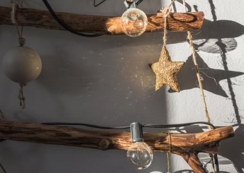 Close up of Christmas tree made from tree branches, wooden stars and string